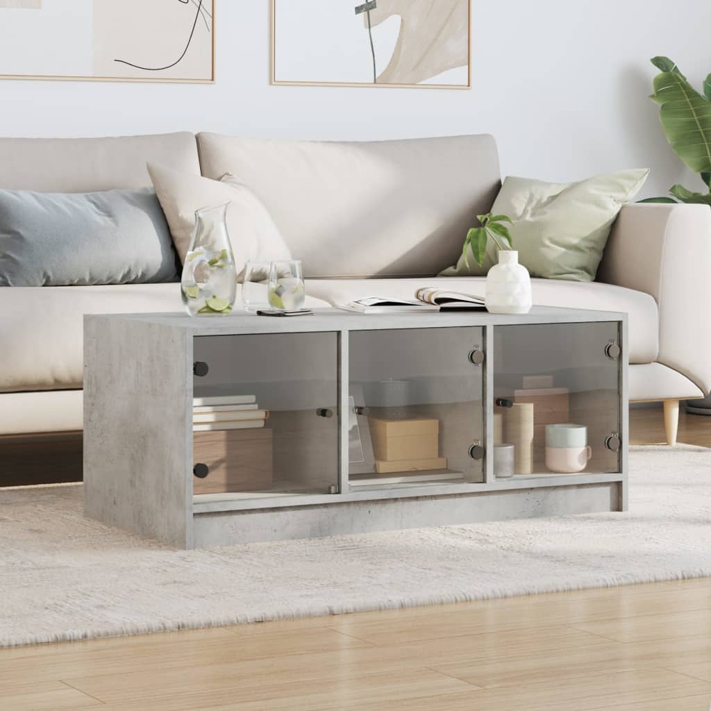 Salongbord med glassdører betonggrå 102x50x42 cm