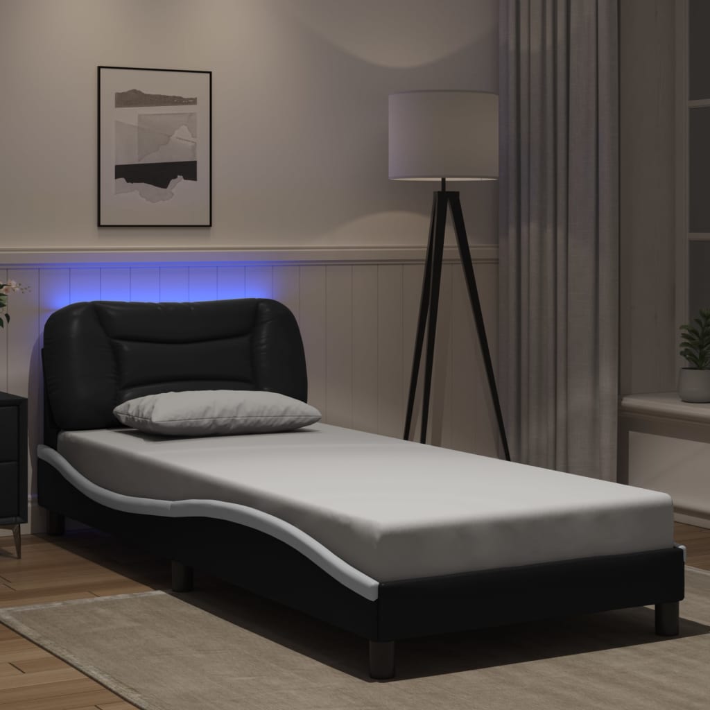 Sengeramme med LED-lys svart og hvit 180x200 cm kunstig lær